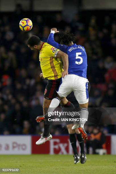 Watford's English striker Troy Deeney vies with Everton's English-born Welsh defender Ashley Williams during the English Premier League football...
