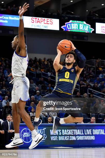 Marquette Golden Eagles guard Markus Howard shoots against DePaul Blue Demons guard Brandon Cyrus on February 24, 2018 at the Wintrust Arena in...