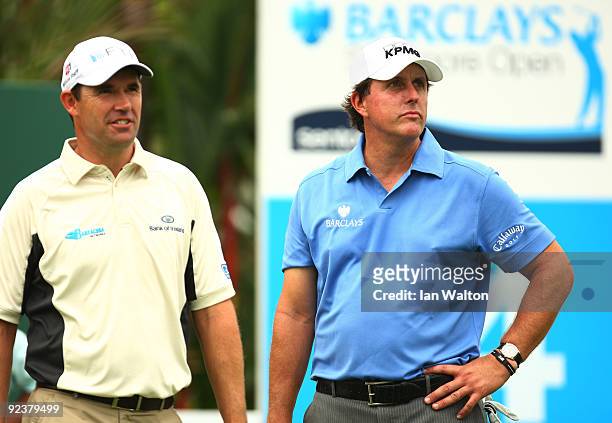 Padraig Harrington of Ireland and Phil Mickelson of USA look down the 14th during the practice round of the Barclays Singapore Open at Sentosa Golf...