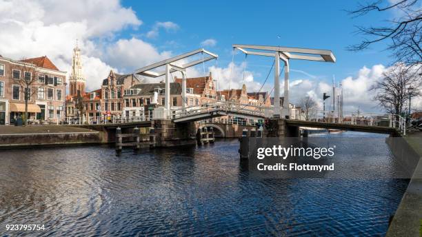 view from the river spaarne towards the historical city center of haarlem - haarlem netherlands stock pictures, royalty-free photos & images