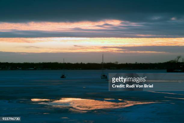 manhasset bay, long island, frozen at sunset, ny. - manhasset stock pictures, royalty-free photos & images