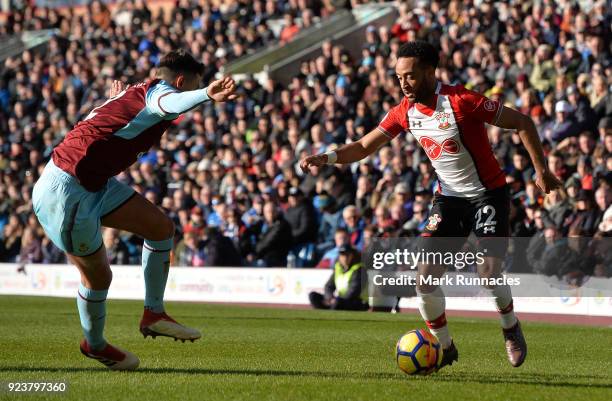 Nathan Redmond of Southampton is challenged by Matthew Lowton of Burnley during the Premier League match between Burnley and Southampton at Turf Moor...