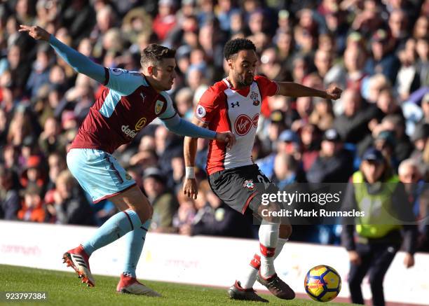 Nathan Redmond of Southampton is challenged by Matthew Lowton of Burnley during the Premier League match between Burnley and Southampton at Turf Moor...