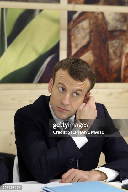 French President Emmanuel Macron attends a meeting with industry professionals during his visit at the 55th International Agriculture Fair at the...