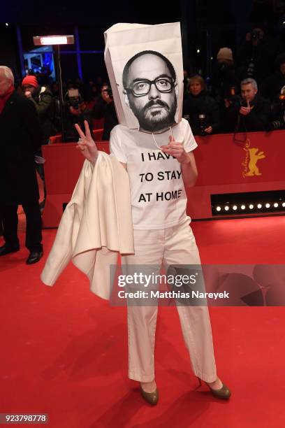 Franziska Petri wears a bag on her head with a picture of Russian director Kirill Serebrennikov on it during the closing ceremony during the 68th...