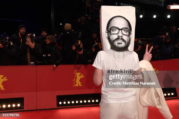 Franziska Petri wears a bag on her head with a picture of Russian director Kirill Serebrennikov on it during the closing ceremony during the 68th...