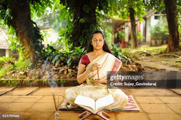 hindu woman in meditation - chant stock pictures, royalty-free photos & images