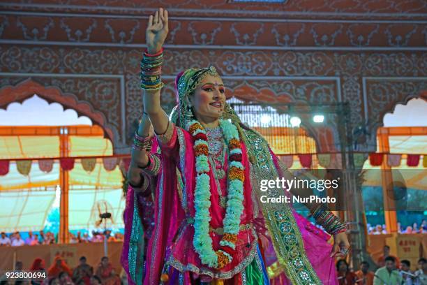 Rajasthani folk artists perform during the Fag Mahotsav celebration at historical Govind Dev Ji temple ahead the Holi festival , in Jaipur, Rajasthan...