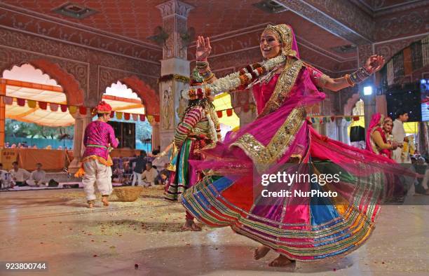 Rajasthani folk artists perform during the Fag Mahotsav celebration at historical Govind Dev Ji temple ahead the Holi festival , in Jaipur, Rajasthan...