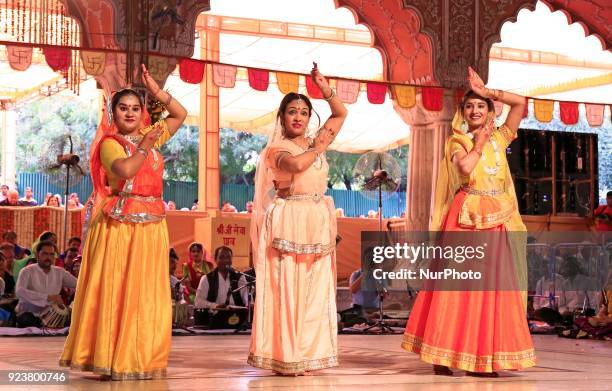 Rajasthani folk artists perform during the Fag Mahotsav celebration at historical Govind Dev Ji temple ahead the Holi festival , in Jaipur, Rajasthan...