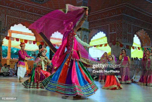 Rajasthani folk artists perform during the Fag Mahotsav celebration at historical Govind Dev Ji temple ahead the Holi festival , in Jaipur, Rajasthan...