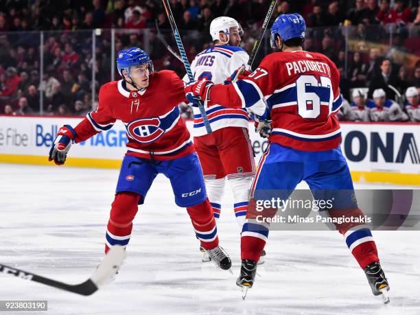 Noah Juulsen and Max Pacioretty of the Montreal Canadiens get tangled up with each other against the New York Rangers during the NHL game at the Bell...