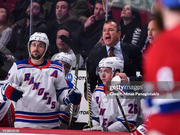 Head coach of the New York Rangers Alain Vigneault yells out from behind the bench against the Montreal Canadiens during the NHL game at the Bell...