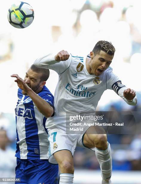 Cristiano Ronaldo of Real Madrid competes for the ball with Victor Laguardia of Deportivo Alaves during the La Liga match between Real Madrid and...