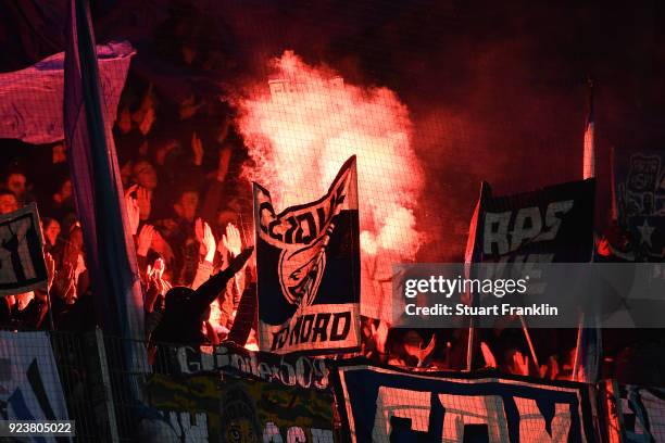 Supporters of Hamburg light flares during the Bundesliga match between SV Werder Bremen and Hamburger SV at Weserstadion on February 24, 2018 in...