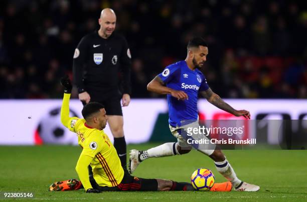 Etienne Capoue of Watford tackles Theo Walcott of Everton during the Premier League match between Watford and Everton at Vicarage Road on February...