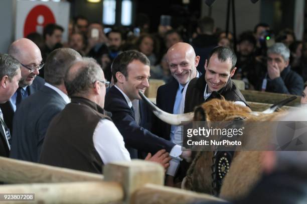 French President Emmanuel Macron visits the 55th International Agriculture Fair at the Porte de Versailles exhibition center in Paris, on February...
