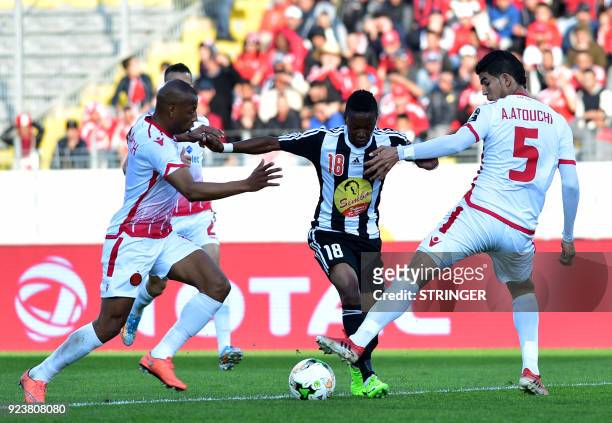 Mazembe's Zambian midfielder Rainford Kalaba vies for the ball against Wydad Casablanca's Moroccan defender Amine Atouchi during the 2018 Total CAF...