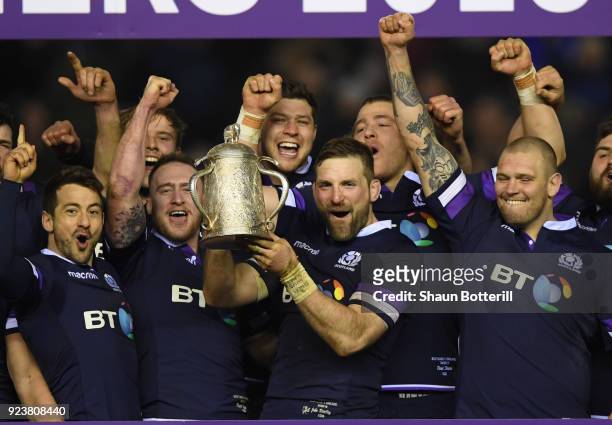 John Barclay of Scotland holds aloft the Calcutta Cup and leads the celebrations with the team after victory in the NatWest Six Nations match between...