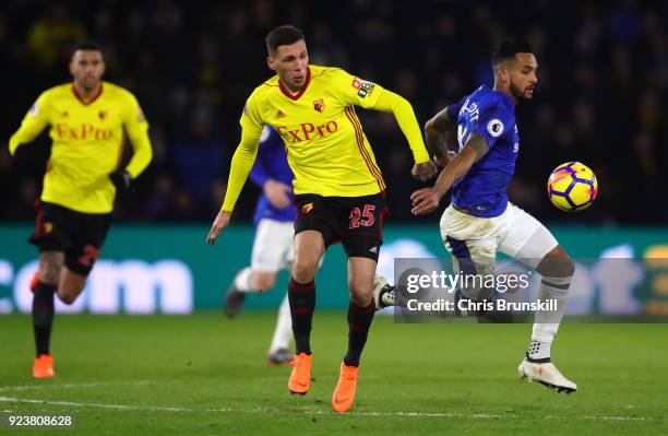 Jose Holebas of Watford and Theo Walcott of Everton battle for possession during the Premier League match between Watford and Everton at Vicarage...