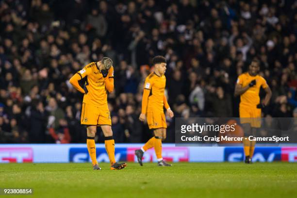Wolverhampton Wanderers' Romain Saiss looks dejected after his side concede their second goal during the Sky Bet Championship match between Fulham...