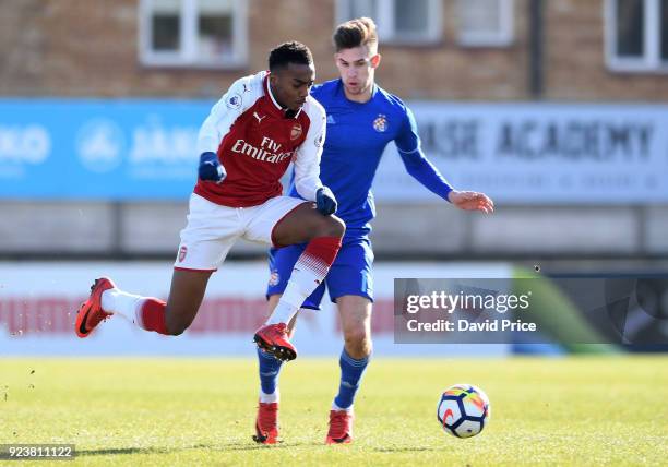 Joe Willock skips passed Mario Cuze of Dinamo during the match between Arsenal and Dinamo Zagreb at Meadow Park on February 24, 2018 in Borehamwood,...