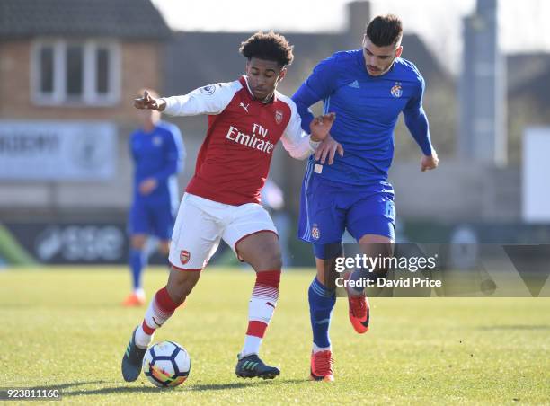Reiss Nelson of Arsenal takes on Karlo Muhar of Dinamo during the match between Arsenal and Dinamo Zagreb at Meadow Park on February 24, 2018 in...