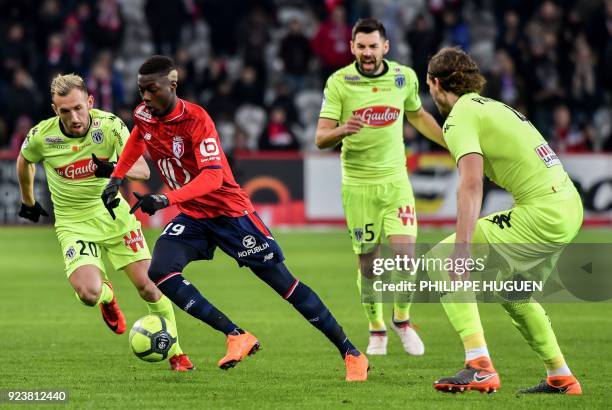 Angers' French midfielder Flavien Tait vies with Lille's Ivorian forward Nicolas Pepe during the French L1 football match Lille vs Angers on February...