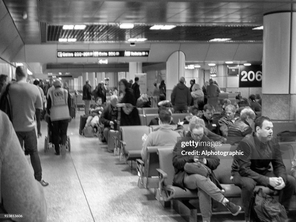 Manchester airport shops with passengers