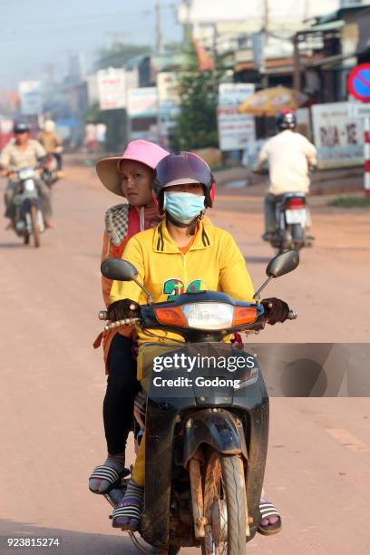 Couple riding scooter. Thay Ninh. Vietnam.
