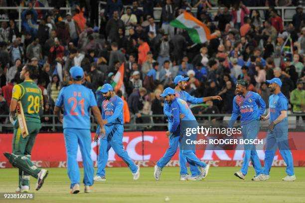 India's players celebrate after winning the third T20 cricket match between India and South Africa at the Newlands Cricket Ground on February 24,...