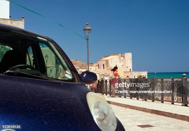 tourists look at the mediterranean sea in sicily - marcoventuriniautieri stock pictures, royalty-free photos & images