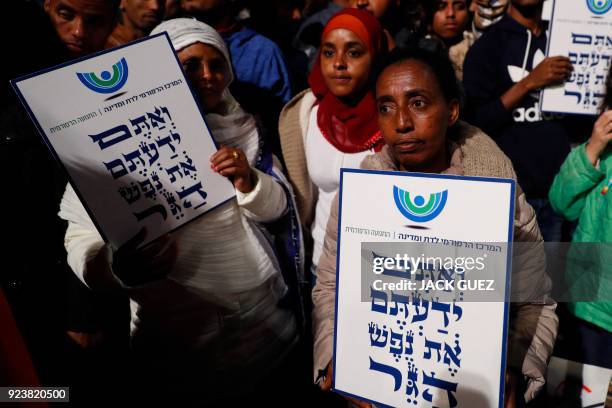 African migrants hold signs reading in Hebrew "You come from the Bible, you too are refugees", during a demonstration in the Israeli coastal city of...