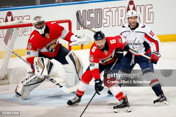 Goaltender Roberto Luongo of the Florida Panthers defends the net with the help of teammate Alex Petrovic against Brett Connolly of the Washington...