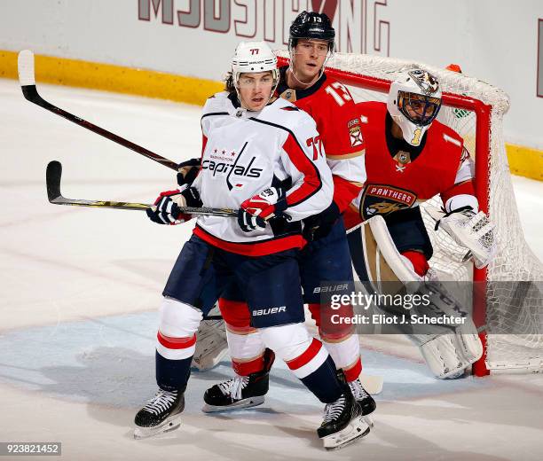 Goaltender Roberto Luongo of the Florida Panthers defends the net with the help of teammate Mark Pysyk against T.J. Oshie of the Washington Capitals...