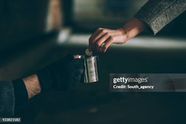 a helping hand - beggar stock pictures, royalty-free photos & images