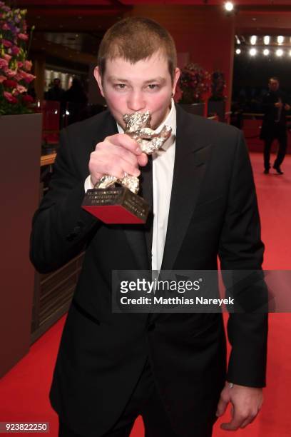 Anthony Bajon, winner of the Silver Bear for Best Actor for 'The Prayer', poses with his award after the closing ceremony during the 68th Berlinale...
