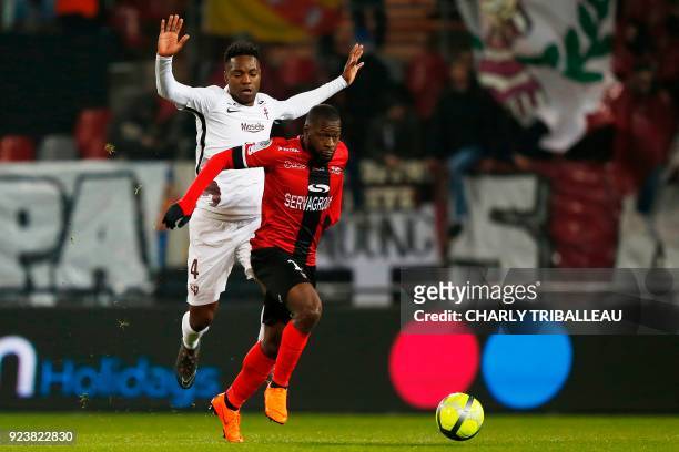Metz' Cameroonian defender Georges Mandjeck vies for the ball with Guingamp's French midfielder Yannis Salibur during the French L1 football match...