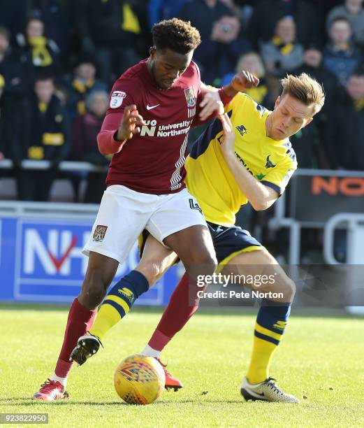 Gboly Ariyibi of Northampton Town controls the ball under pressure from Todd Kane of Oxford United during the Sky Bet League One match between...