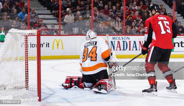 Zack Smith of the Ottawa Senators reacts as the puck gets past Petr Mrazek of the Philadelphia Flyers for a power-play goal by Mike Hoffman of the...