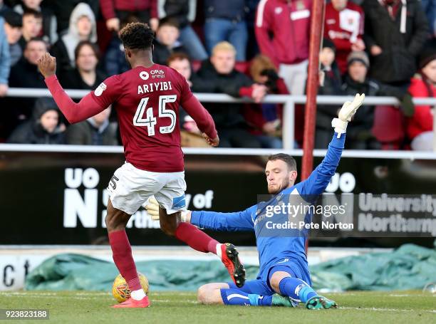 Gboly Ariyibi of Northampton Town attempts to take the ball past Simon Eastwood of Oxford United during the Sky Bet League One match between...