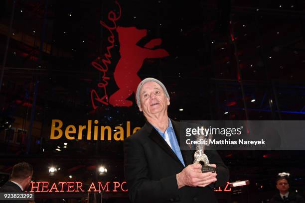 Bill Murray, accepting the award for Wes Anderson , pose with the award after the closing ceremony during the 68th Berlinale International Film...
