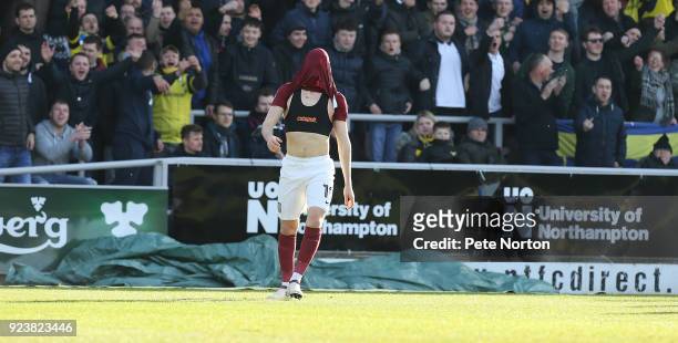 Chris Long of Northampton Town hides his head with his shirt after seeing a shot at goal go wide during the Sky Bet League One match between...