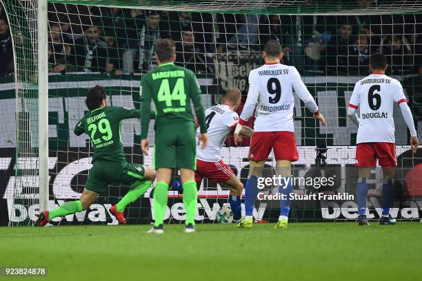 Ishak Belfodil of Bremen about to score a goal past Rick van Drongelen of Hamburg to make it 1:0 during the Bundesliga match between SV Werder Bremen...