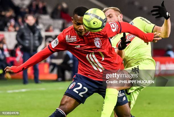 Lille's Brazilian midefielder Thiago Maia vies with Angers' French midfielder Flavien Tait during the French L1 football match Lille vs Angers on...