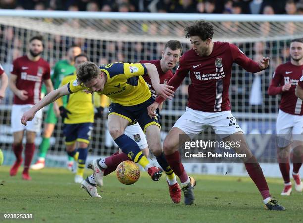 Rob Dickie of Oxford United attempts to control the ball under pressure from Matt Crooks of Northampton Town during the Sky Bet League One match...