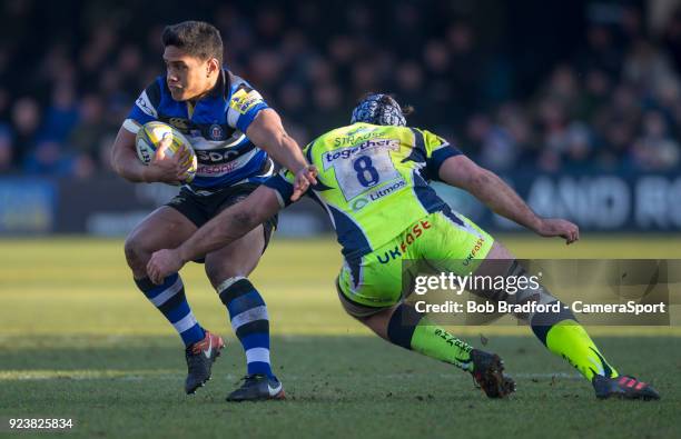 Bath Rugby's Ben Tapuai evades the tackle of Sale Sharks' Josh Strauss during the Aviva Premiership match between Bath Rugby and Sale Sharks at...