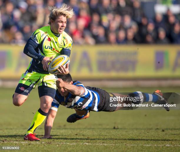 Sale Sharks' Faf de Klerk evades the tackle of Bath Rugby's Ben Tapuai during the Aviva Premiership match between Bath Rugby and Sale Sharks at...