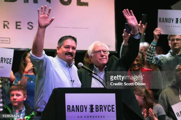 Sen. Bernie Sanders campaigns with Randy Bryce at a rally on February 24, 2018 in Racine, Wisconsin. Bryce, a union ironworker, is hoping to defeat...
