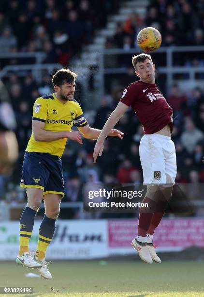 Chris Long of Northampton Town contests the ball with John Mousinho of Oxford United during the Sky Bet League One match between Northampton Town and...